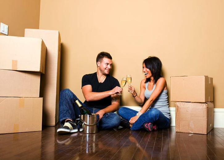 couple having a drink before moving in together